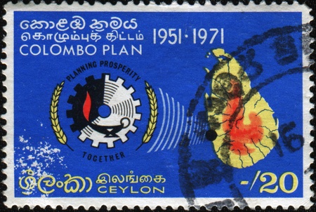 CEYLON - CIRCA 1951: A stamp honoring Colombo plan for the development of Ceylon, circa 1951の写真素材