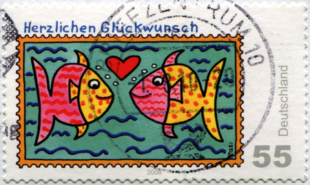 GERMANY - CIRCA 2008: A stamp printed in Germany shows Fish lovers, circa 2008の写真素材