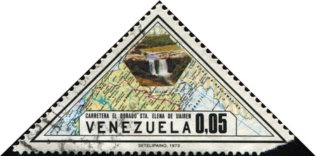 VENEZUELA - CIRCA 1973: A stamp printed in Venezuela honoring Completion of Golden Highway shows Map and waterfall, circa 1973の写真素材