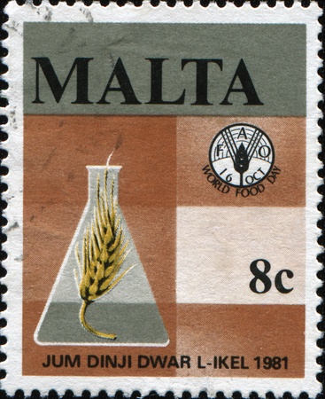 MALTA - CIRCA 1981: A stamp printed in Malta shows honoring world food day, circa 1981の写真素材