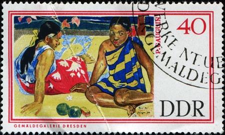 GERMAN DEMOCRATIC REPUBLIC - CIRCA 1967: A stamp printed in GDR (East Germany) shows "Tahitian Women on the Beach" by Paul Gauguin, circa 1967 のeditorial素材
