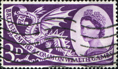 UK - CIRCA 1958: A stamp printed in Britain showing a Welsh dragon celebrating the British Empire and Commonwealth games, circa 1958 のeditorial素材