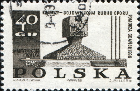 POLAND - CIRCA 1969: A Stamp printed in Poland honoring Polish Martyrdom and Resistance, 1939-45, shows Guerillas' Monument, Kartuzy, circa 1969の写真素材