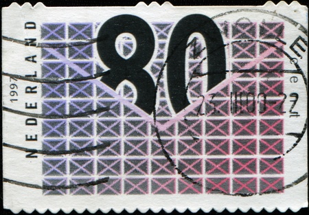 NETHERLANDS - CIRCA 1997: A stamp printed in Netherlands  shows number 80  in envelope with Top Flap, circa 1997の写真素材