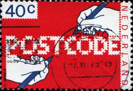 NETHERLANDS - CIRCA 1978: A stamp printed in Netherlands honoring Introduction of Postcodes, circa 1978の写真素材