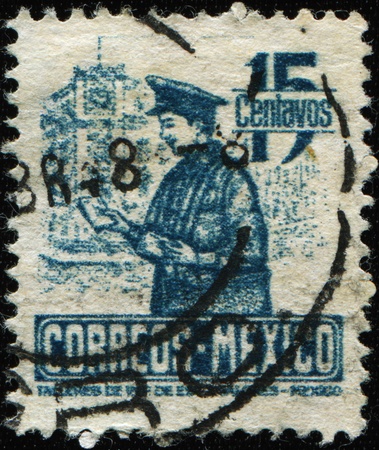 MEXICO - CIRCA 1947: A stamp printed in Mexico shows Postman , circa 1947の写真素材
