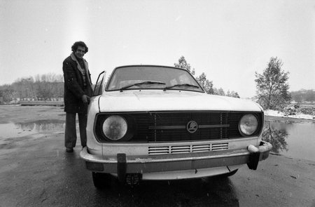 BULGARIA - CIRCA 1980  young man demonstrates just bought him a car, Rousse, Bulgaria, circa 1980