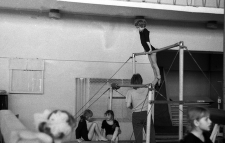 USSR - CIRCA 1975: Girls on the uneven bars at sports school, Kursk, Russia, circa 1975のeditorial素材