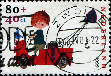 NETHERLANDS - CIRCA 1999: Stamp printed in Netherlands shows Characters created by Fiep Westendorp, Pluk van de Pettevlet on Fire Engine, circa 1999のeditorial素材
