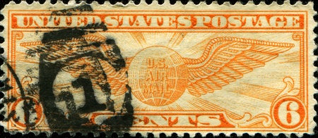 USA - CIRCA 1934: A Stamp printed in USA shows the Winged Globe, circa 1934 のeditorial素材