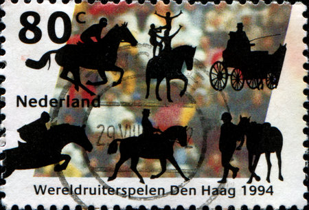 NETHERLANDS - CIRCA 1994: A stamp printed in  Netherlands honoring Equestrian sports, World Equestrian Games, The Haguel, circa 1994のeditorial素材