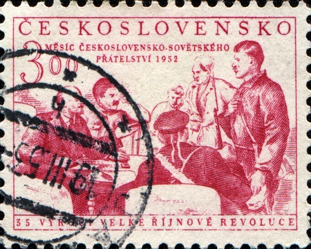 CZECHOSLOVAKIA - CIRCA 1952: A stamp printed in Czechoslovakia honoring 35th Anniversary of Russian Revolution, shows Lenin, Stalin and Revolutionarie , circa 1952 のeditorial素材