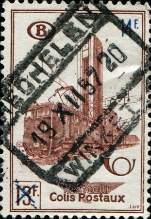 BELGIUM - CIRCA 15649: A railway stamp printed in  Belgium shows Electric Train Type 121 and Nord Station, Brussels, circa 1956 の写真素材