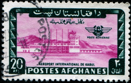 AFGHANISTAN - CIRCA 1964: A stamp printed in Afghanistan shows International airport in Kabul, circa 1964の写真素材