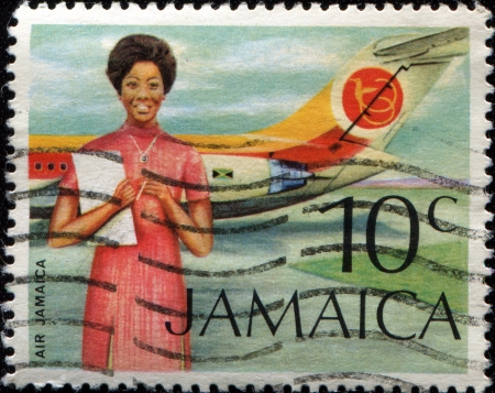 JAMAICA - CIRCA 1972: A stamp printed in Jamaica shows Air Jamaica Hostess and Vickers VC-10の写真素材