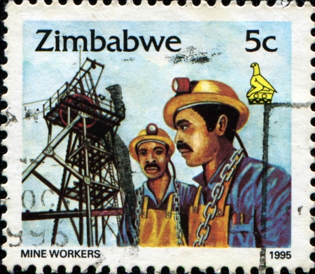 ZIMBABWE - CIRCA 1995: A stamp printed in Zimbabwe shows mine workers, circa 1995 の写真素材