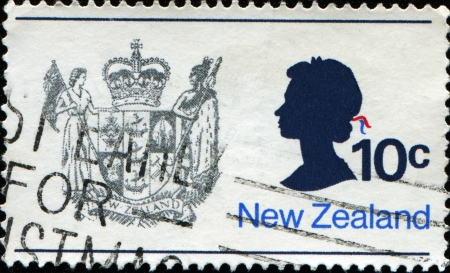 NEW ZEALAND - CIRCA 1970  A stamp printed in New Zealand shows the New Zealand Coat of Arms and Queen Elizabeth II, circa 1970 のeditorial素材