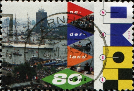 NETHERLANDS - CIRCA 1995  A stamp printed in Netherlands shows Amsterdam harbour, Sail の写真素材