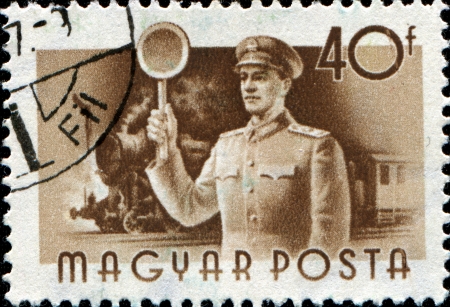 HUNGARY - CIRCA 1955  A stamp printed in Hungary shows Railwayman and train, series, circa 1955 のeditorial素材