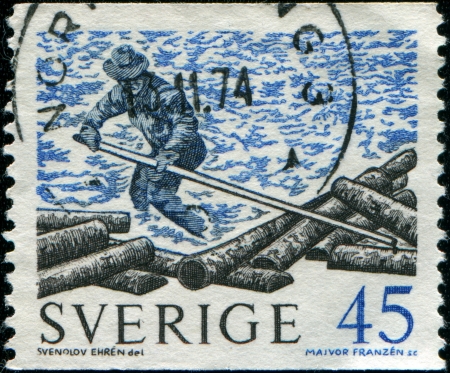 SWEDEN - CIRCA 1967  A stamp printed in Sweden shows Floating logs, circa 1967 の写真素材