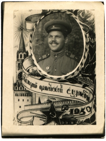 USSR - CIRCA 1950  Portrait of the Soviet Army sergeant in the vignette featuring the Moscow Kremlin, circa 1950, the Russian text - pool at a service in the armyのeditorial素材