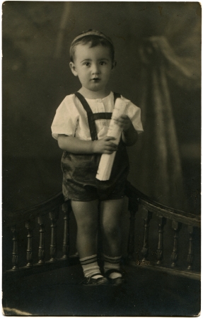 USSR - CIRCA 1950s  The little boy in shorts standing on a bench, circa 1950sのeditorial素材