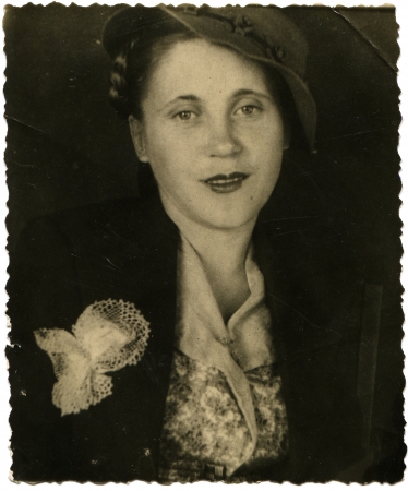USSR - CIRCA 1947  Studio portrait of a young woman in a hat, circa 1947のeditorial素材