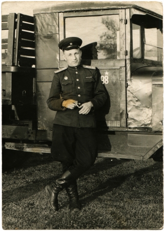 USSR - CIRCA1953  Soviet Army Lieutenant standing near the truck cab, Kharkov, Ukraine, circa 1953のeditorial素材
