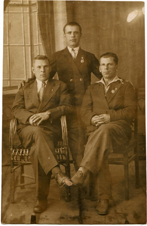 USSR - CIRCA 1933  Reproduction of photo was take in USSR shows cabinet portrait of of three men in...