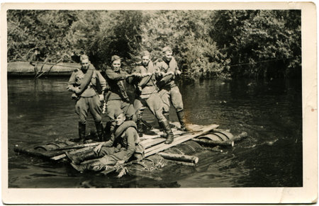 USSR - CIRCA 1960s  Reproduction of photo was made in the USSR shows a group of soldiers crossing...