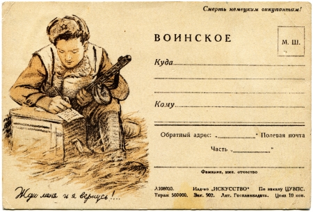 USSR  - CIRCA 1942  Rare postcard printed in the USSR shows soldier writes a letter, circa 1942  Russian text  Death to the German occupiers, Wait for me and Iのeditorial素材
