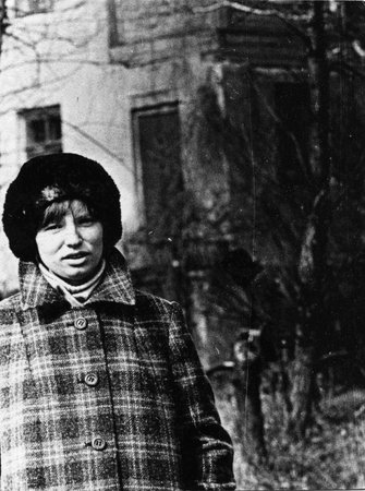 young woman in a checkered coat and hat, 1977