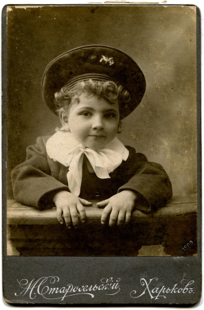 RUSSIA - CIRCA1908  An antique photo shows little curly-haired boy in his cap and sailor, Kharkov, Russian Empire, now Ukraine, 1908 Russian text  Starosel skiy  photographer , Kharkovのeditorial素材