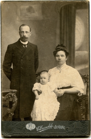 RUSSIA - CIRCA  the end of XIX - early XX century  An antique photo shows couple with daughter, Lugansk, Russian Empire, now Ukraine Russian text  Umanskiy  photographer , Luganskのeditorial素材