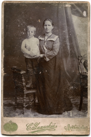 RUSSIA - CIRCA  the end of 19 - early 20 century  An antique photo shows woman with a boy on a...