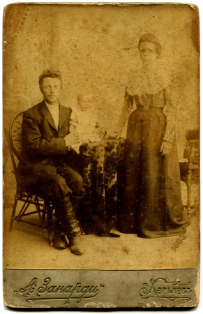 RUSSIA - CIRCA end of the XIX - the beginning of XX century  An antique photo shows couple with daughter, Kharkov, Russian Empire, now UkraineRussian text  Zanardi  photographer ; Kharkov; のeditorial素材