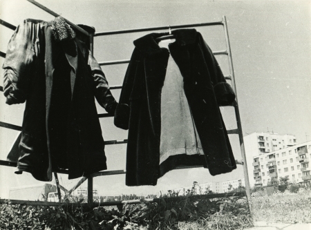 USSR - CIRCA 1979  A photo taking in the USSR shows winter clothes drying in the courtyard of an apartment building, Zavodskaya, Kursk, Russia, June 1979のeditorial素材