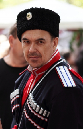 STANITSA LUGANSKAYA, UKRAINE - SEPTEMBER, 8, 2012  Kuban Cossack in clothing of the late 19th...