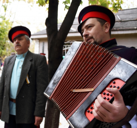  LUGANSK - OCT 14  Don Cossack singing old songs with garmon, celebration of the Protection of the Mother of God, Lugansk, Ukraine, October 14, 2012 のeditorial素材