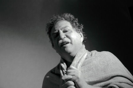 middle-aged man with a towel out of the bathroom 