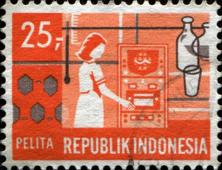  INDONESIA - CIRCA 1969  A stamp printed in Indonesia shows Research worker  Scientific Research , Five-year Development Plan series, circa 1969のeditorial素材