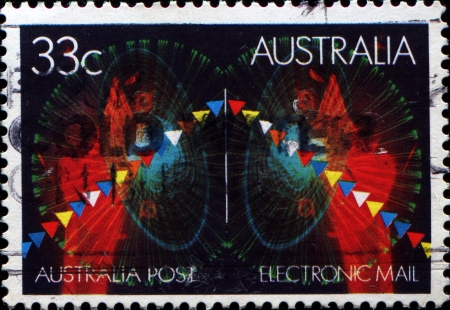  AUSTRALIA - CIRCA 1985  A stamp printed in Australia shows simbols of electronic mail, circa 1985のeditorial素材