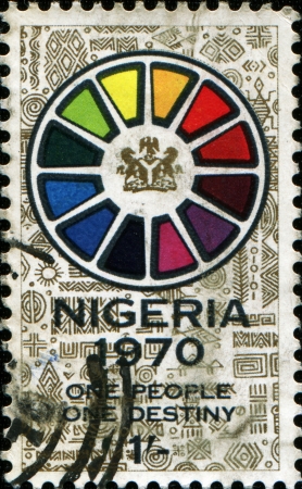  NIGERIA - CIRCA 1970: A stamp printed in Nigeria honoring End of Civil War, shows Symbolic wheel and motto "one people, one destiny", circa 1970 のeditorial素材