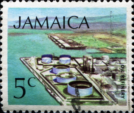 JAMAICA - CIRCA 1972: A stamp printed in Jamaica shows oil refinery, circa 1972のeditorial素材