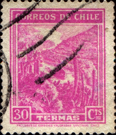 CHILE - CIRCA 1938  A stamp printed in Chile shows view of Termas - spa, ski tracks and Tourist Services Center, circa 1938のeditorial素材