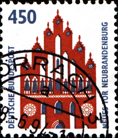 GERMANY - CIRCA 1994  A stamp printed in German Federal Republic shows New Gate, Neubrandenburg, circa 1994のeditorial素材
