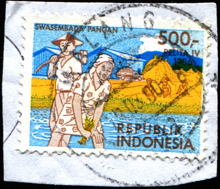 INDONESIA - CIRCA 1986: A stamp printed in Indonesia dedicated 4th Five Year Plan, Agriculture, circa 1986. のeditorial素材
