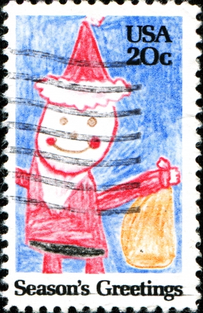 UNITED STATES - CIRCA 1980  A stamp printed in United States shows child drawing of Santa Claus, circa 1980のeditorial素材