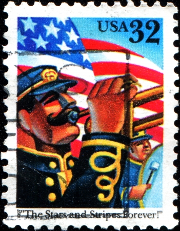 USA - CIRCA 1997  A stamp printed in United States of America shows Trumpeter on the background of the flag,  The Stars and Stripes Forever , circa 1997 のeditorial素材