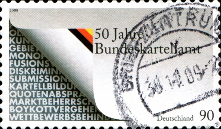 GERMANY - CIRCA 1988  A stamp printed in German Federal Republic depicts Federal Cartel Office is Germanyのeditorial素材